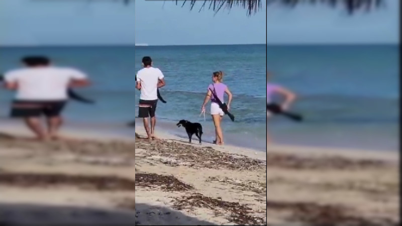 Extranjera se pasea con un arma en las playas de Yucatán