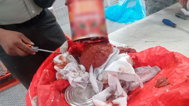 Guardia Nacional asegura 12 kilos de aparente droga sintética ocultos en latas de salsa para pizza 