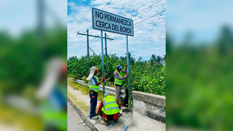 Autoridades advierten sanciones por retirar avisos en puente de Barra de Santa Ana, Lázaro Cárdenas  